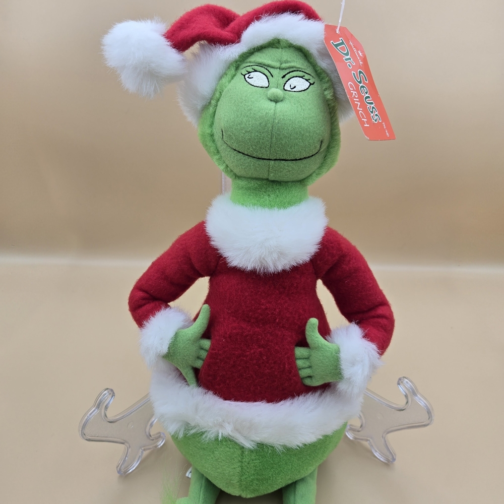 Dr. Seuss Green Grinch with Red Santa Outfit. Hallmark